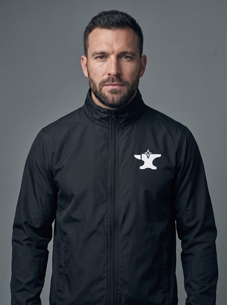 A male model in a branded windbreaker