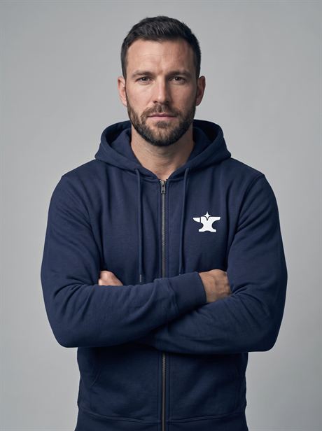 Navy zip-up hoodie, arms crossed — AI-generated product photo, same male model, frame 10 of 25