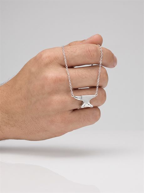 Silver anvil pendant chain held in a hand — AI-generated product photo, nobody in the frame, frame 15 of 25