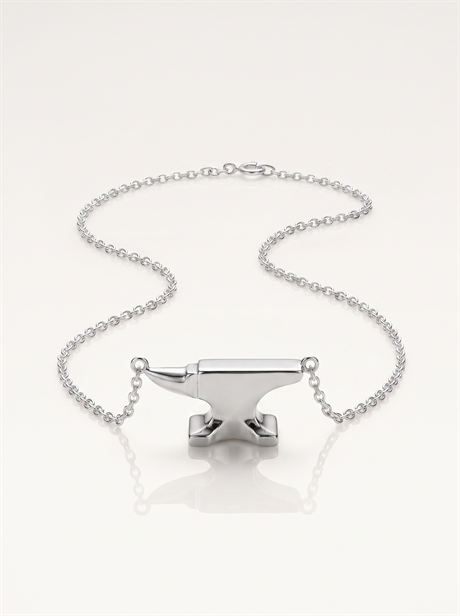 Silver anvil pendant with the full chain laid out — AI-generated product photo, nobody in the frame, frame 17 of 25